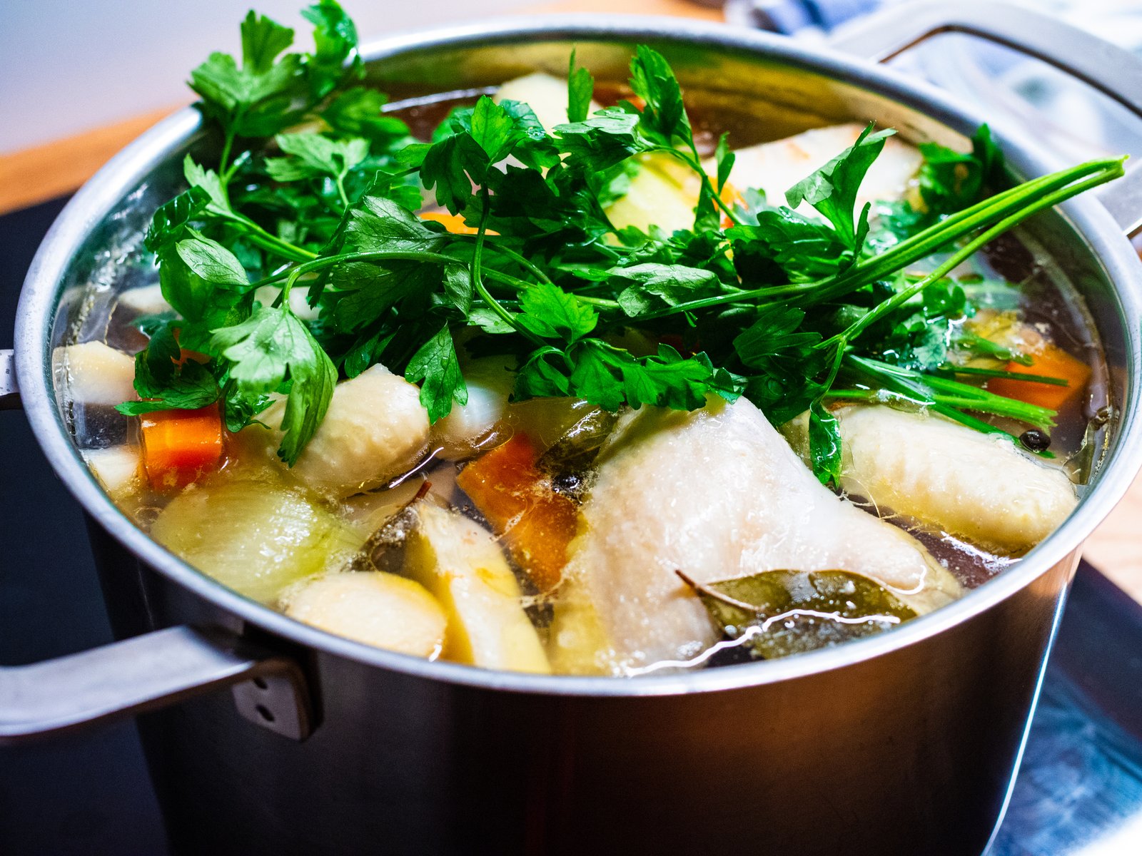 Broth - boiling chicken soup in pot