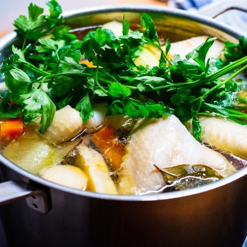 Broth - boiling chicken soup in pot