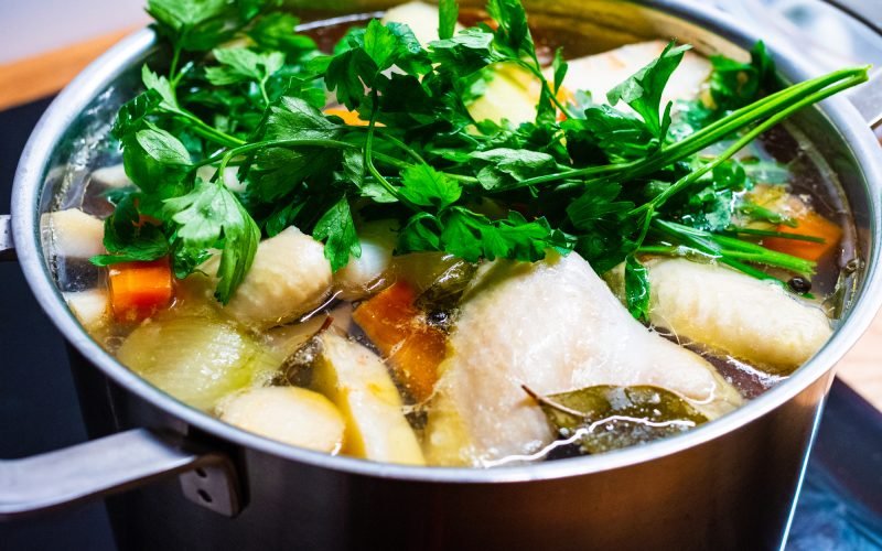 Broth - boiling chicken soup in pot