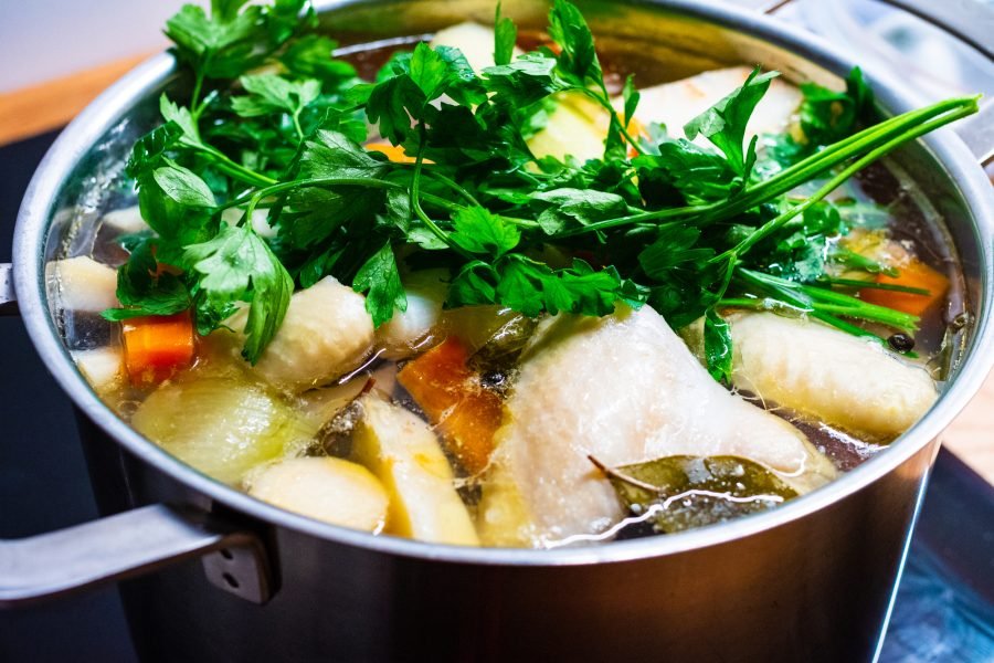 Broth - boiling chicken soup in pot